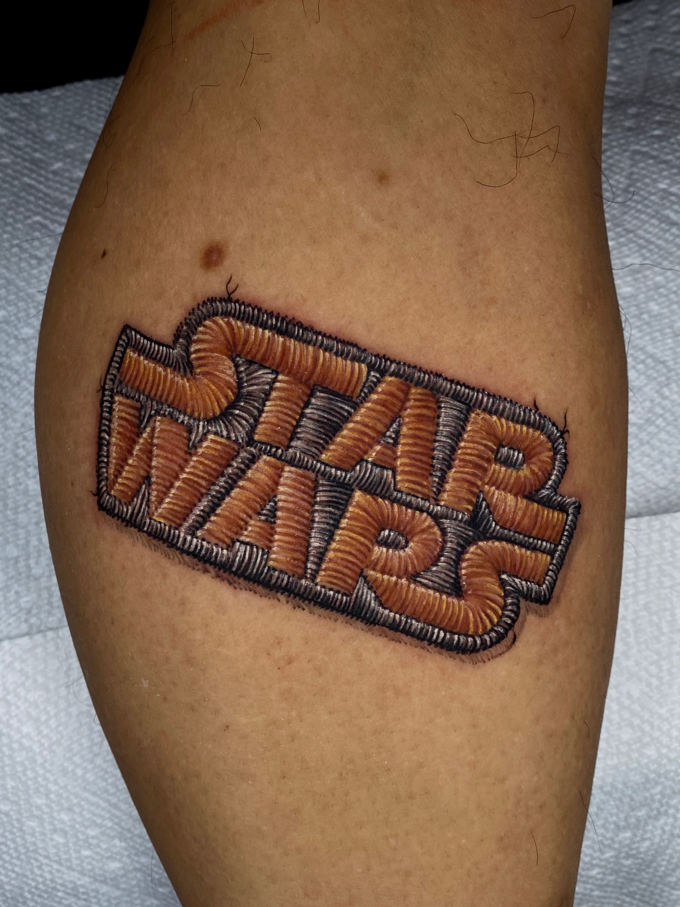 Patchwork tattoo on the calf by Remy at Platinum Tattoos & Piercings, San Antonio TX