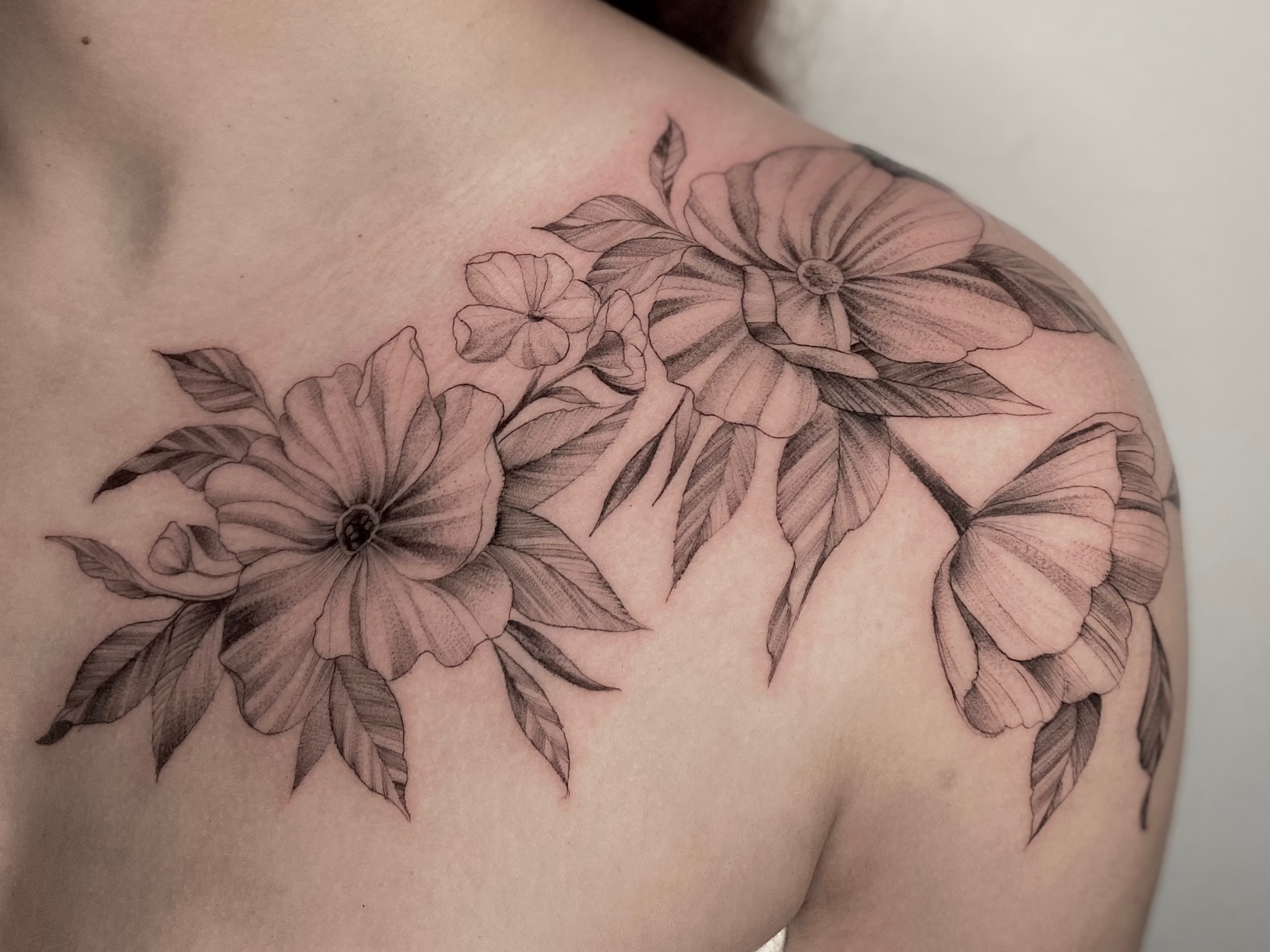 Floral tattoo on the chest by Remy at Platinum Tattoos & Piercings, San Antonio TX