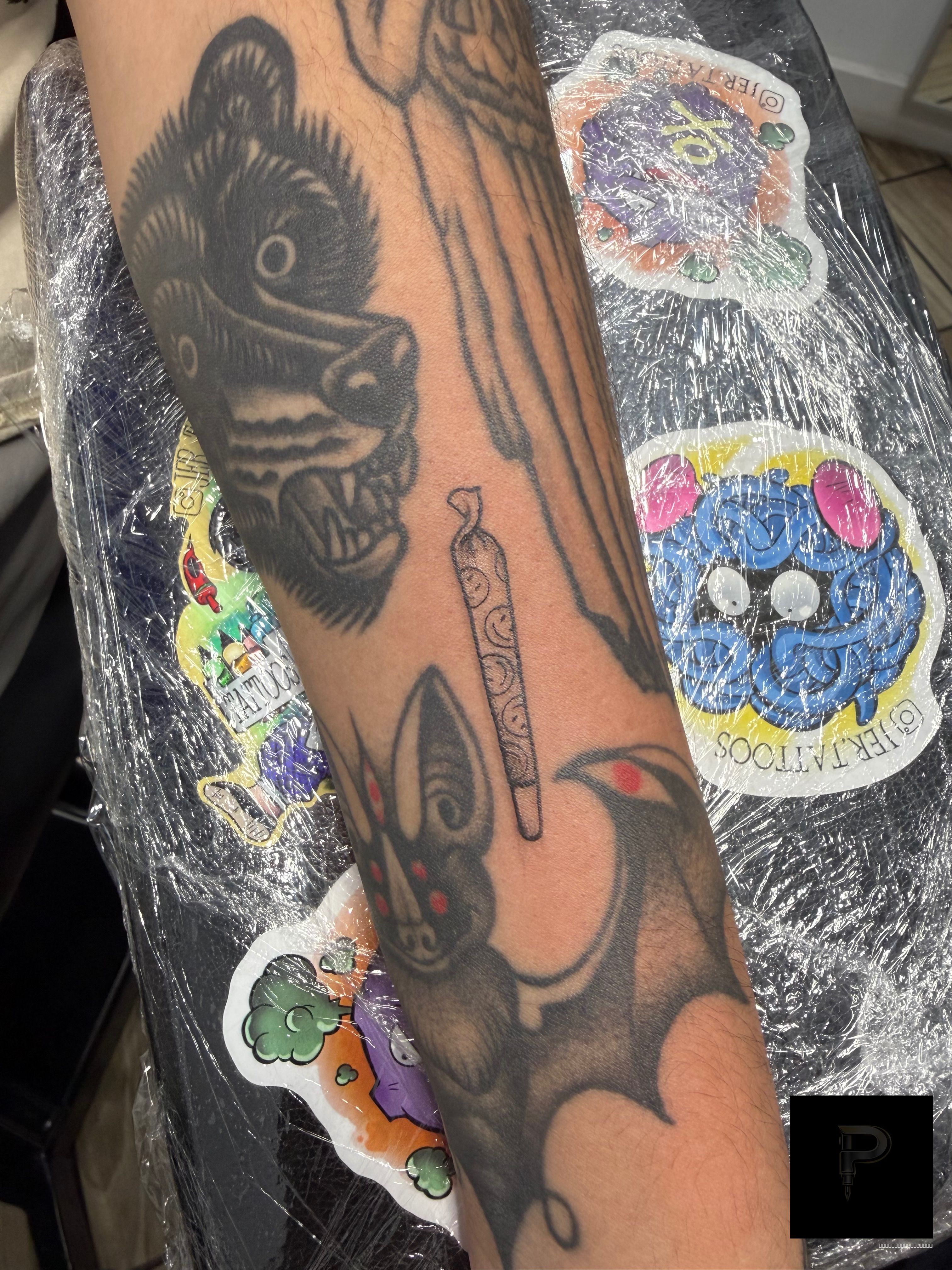 Fine Line Black Cigarro tattoo by Jerson at Platinum Tattoos & Piercings, San Antonio TX