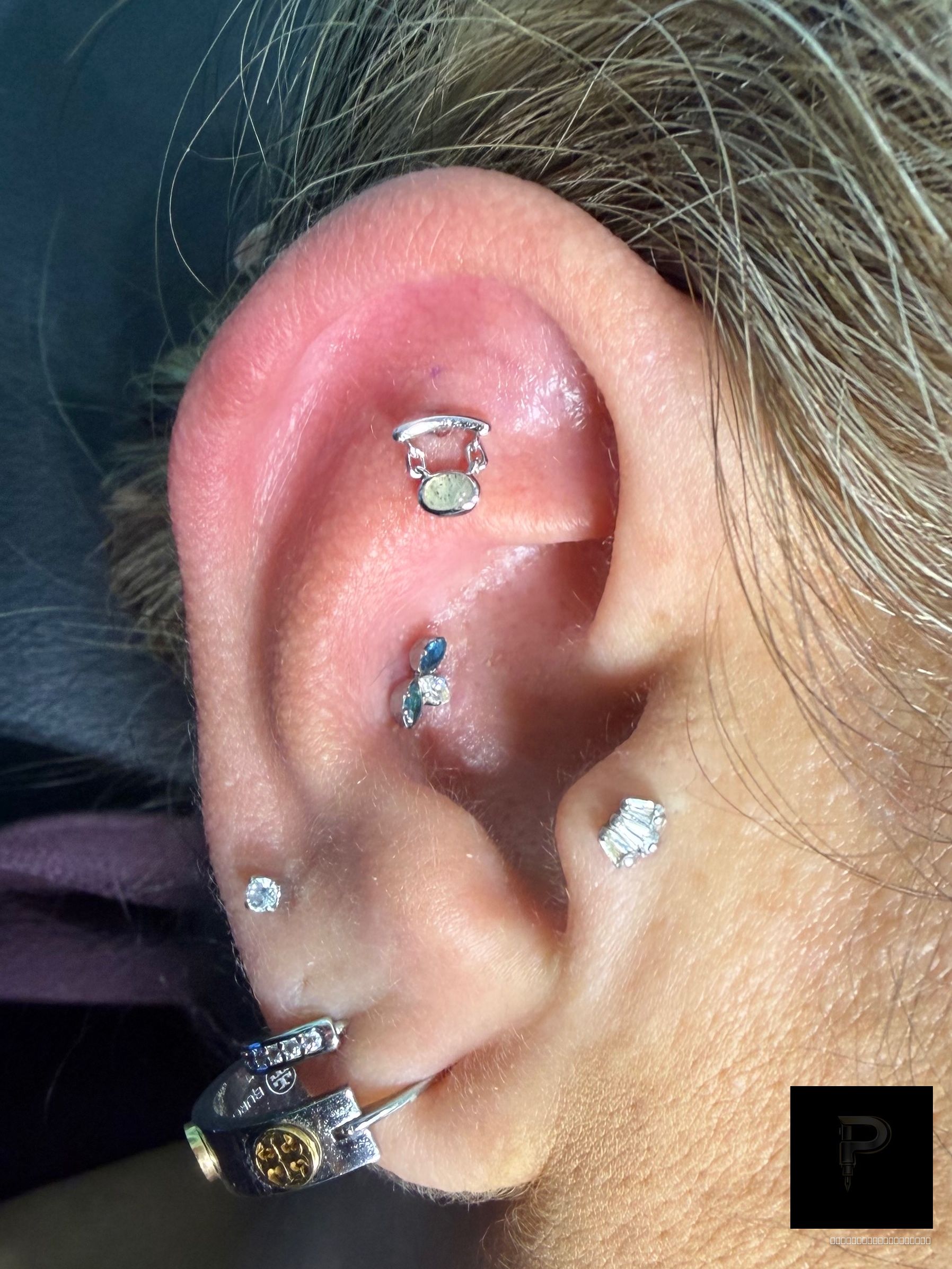 Flat piercing with 14k White Gold Cluster/Multi-Gem by Junipurr by Mingo at Platinum Tattoos & Piercings, San Antonio TX