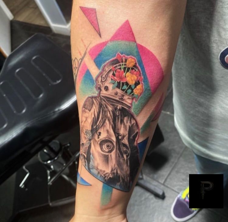 Color, Black & Grey with Color, Abstract Black, White, Pink, Blue, Green, Grey, Multi-Color Flower, Astronaut tattoo on the Forearm by Jordan at Platinum Tattoos & Piercings, San Antonio TX