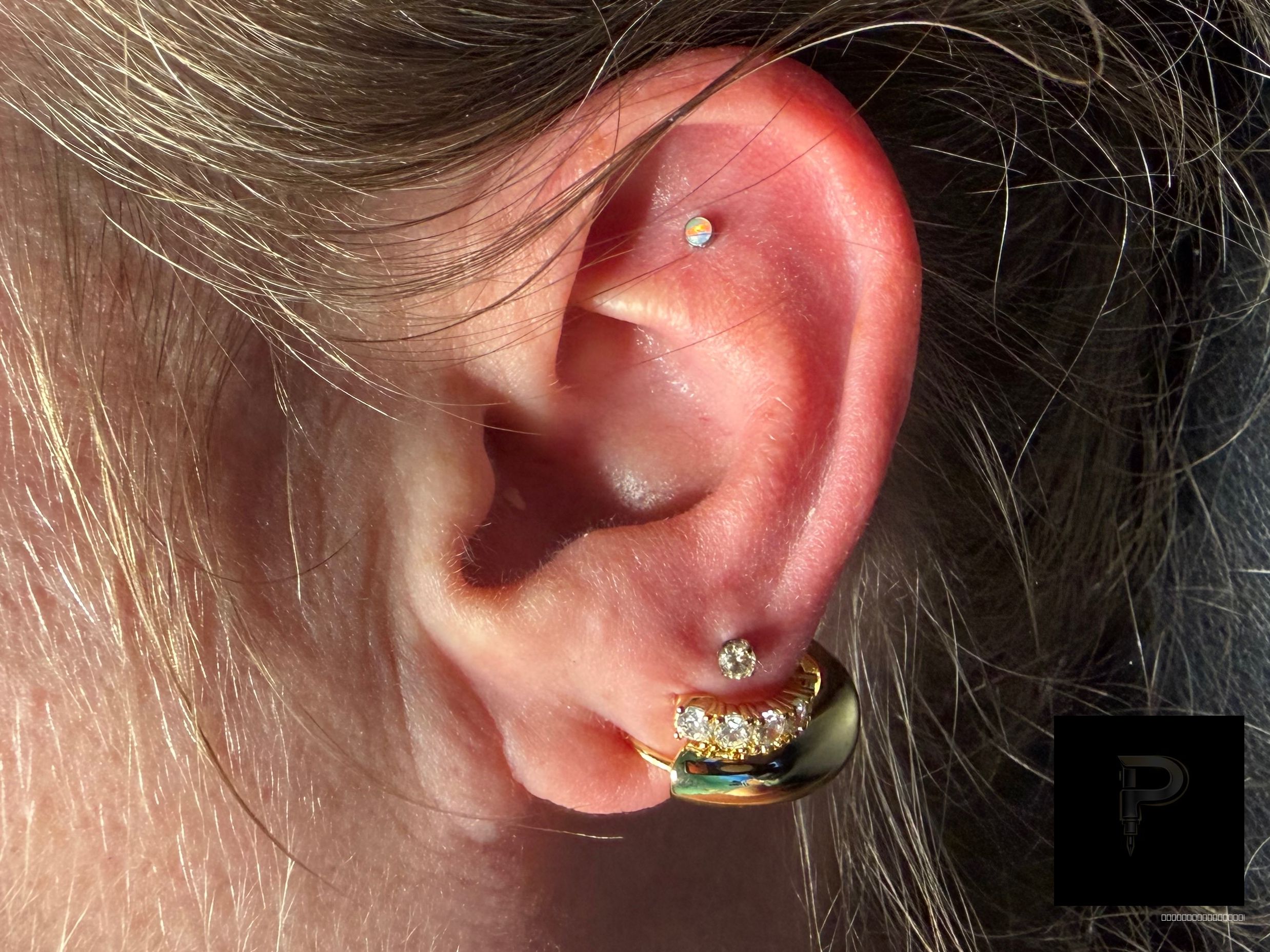 Curated ear piercing setup โ 3rd Lobe, Flat with Implant Grade Titanium Threadless by NeoMetal by Mingo at Platinum Tattoos & Piercings, San Antonio TX