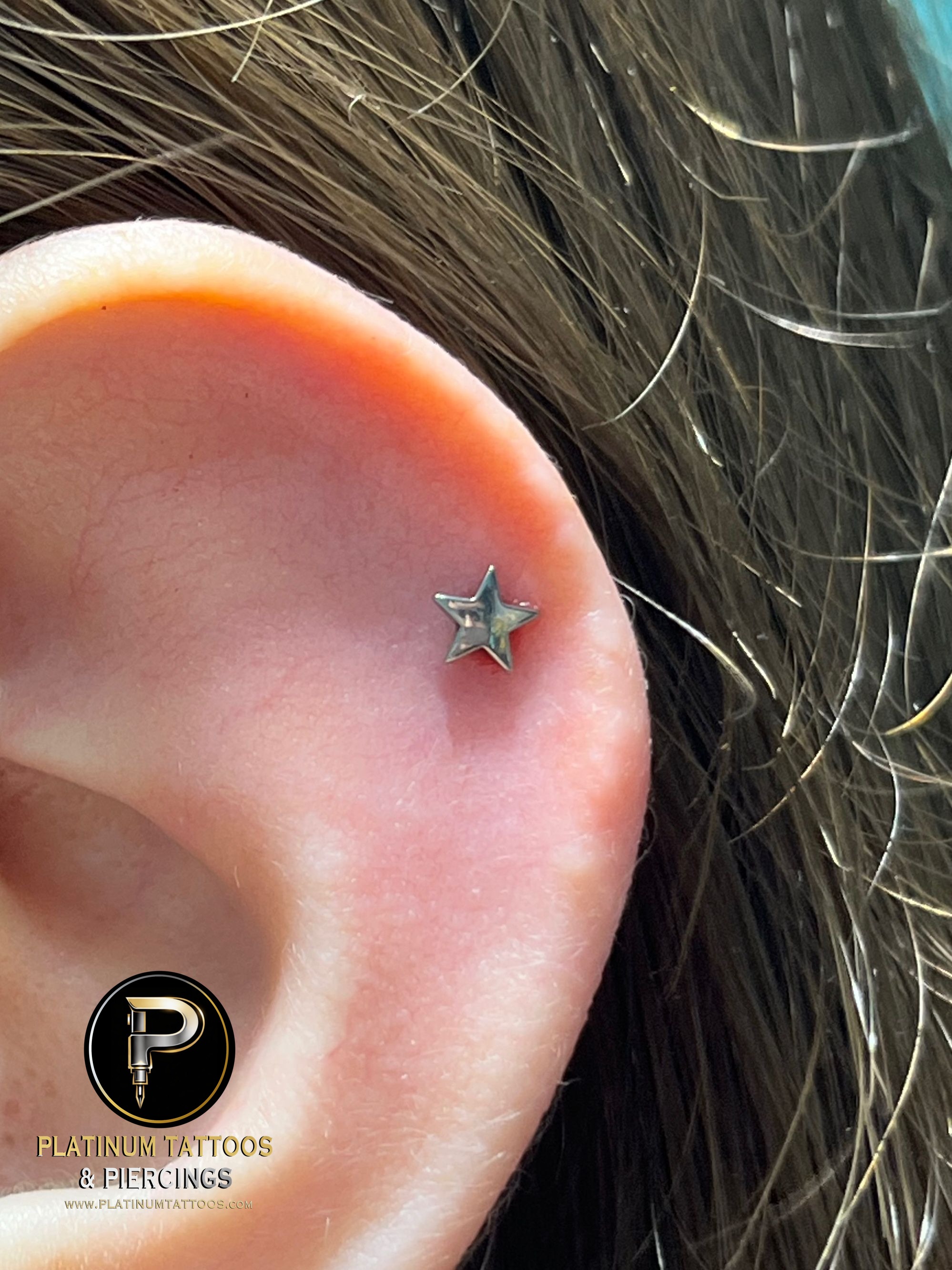 1st Helix piercing with Star by NeoMetal by Harley at Platinum Tattoos & Piercings, San Antonio TX