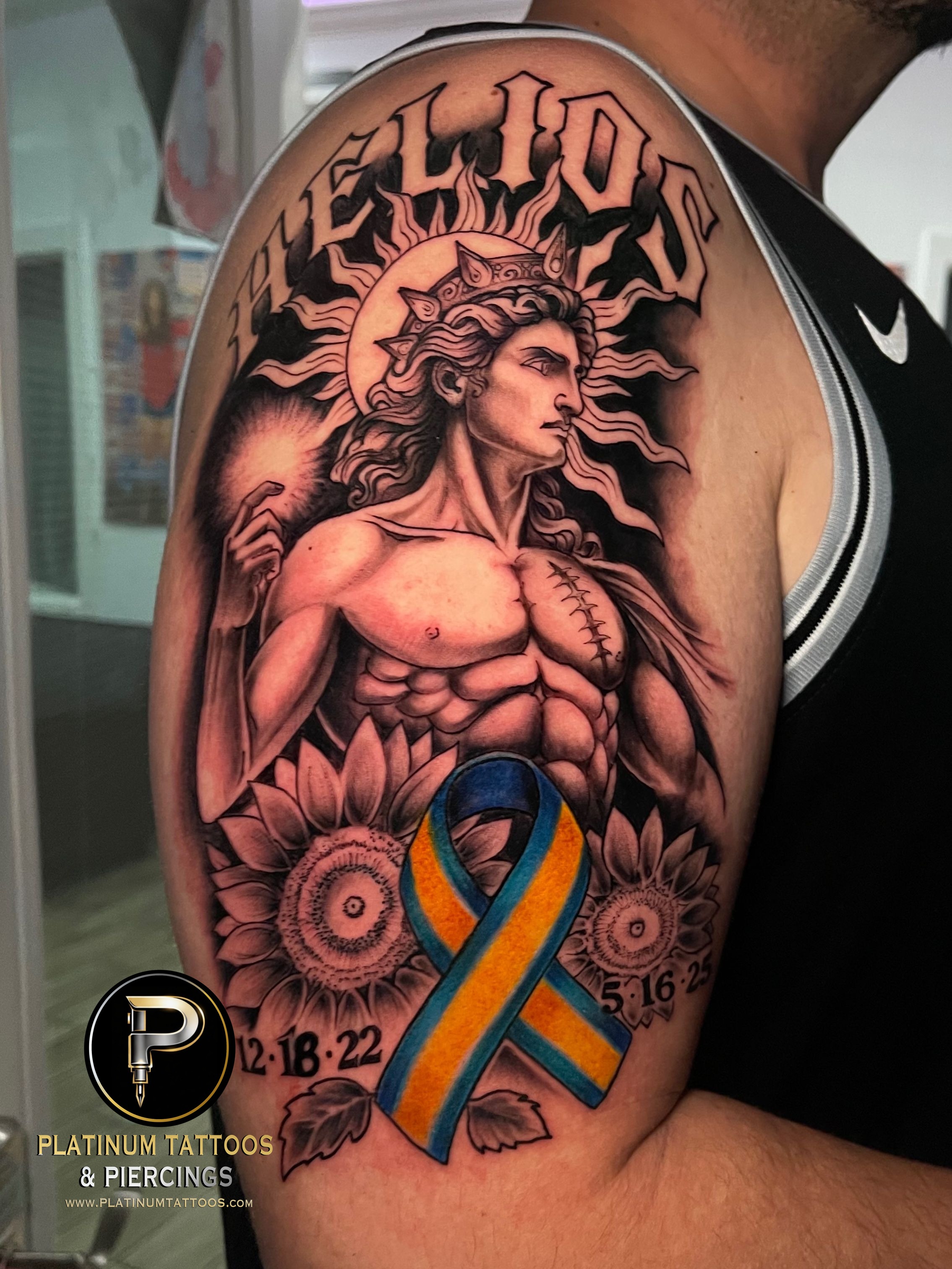 Black & Grey Black, Yellow, Blue tattoo on the Upper Arm by Skar at Platinum Tattoos & Piercings, San Antonio TX
