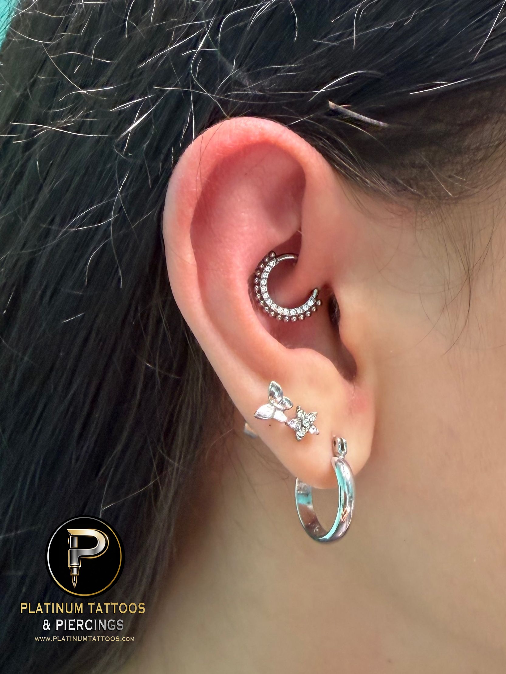 Daith piercing with Implant Grade Titanium Clicker by Other by Mingo at Platinum Tattoos & Piercings, San Antonio TX