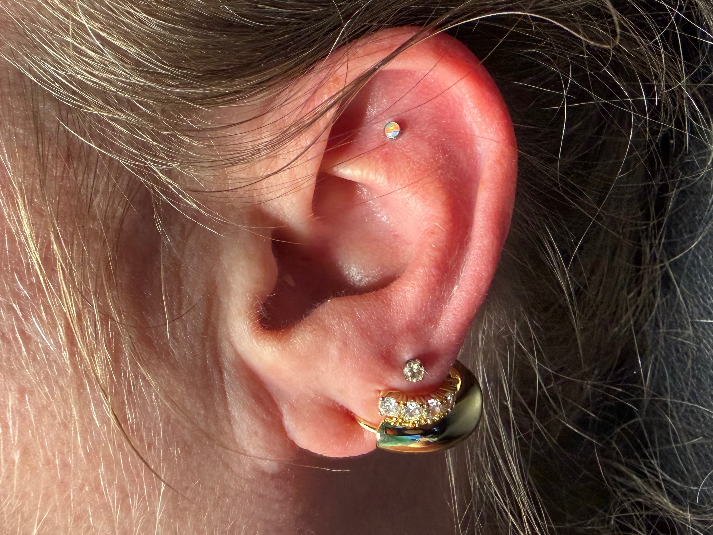 Curated ear piercing setup โ 3rd Lobe, Flat with Implant Grade Titanium Threadless by NeoMetal by Mingo at Platinum Tattoos & Piercings, San Antonio TX