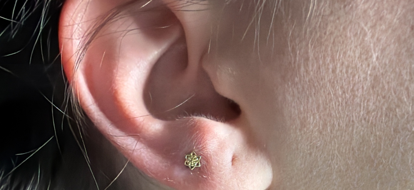 2nd Lobe piercing with 14k Yellow Gold Threadless by Tawapa by Mingo at Platinum Tattoos & Piercings, San Antonio TX