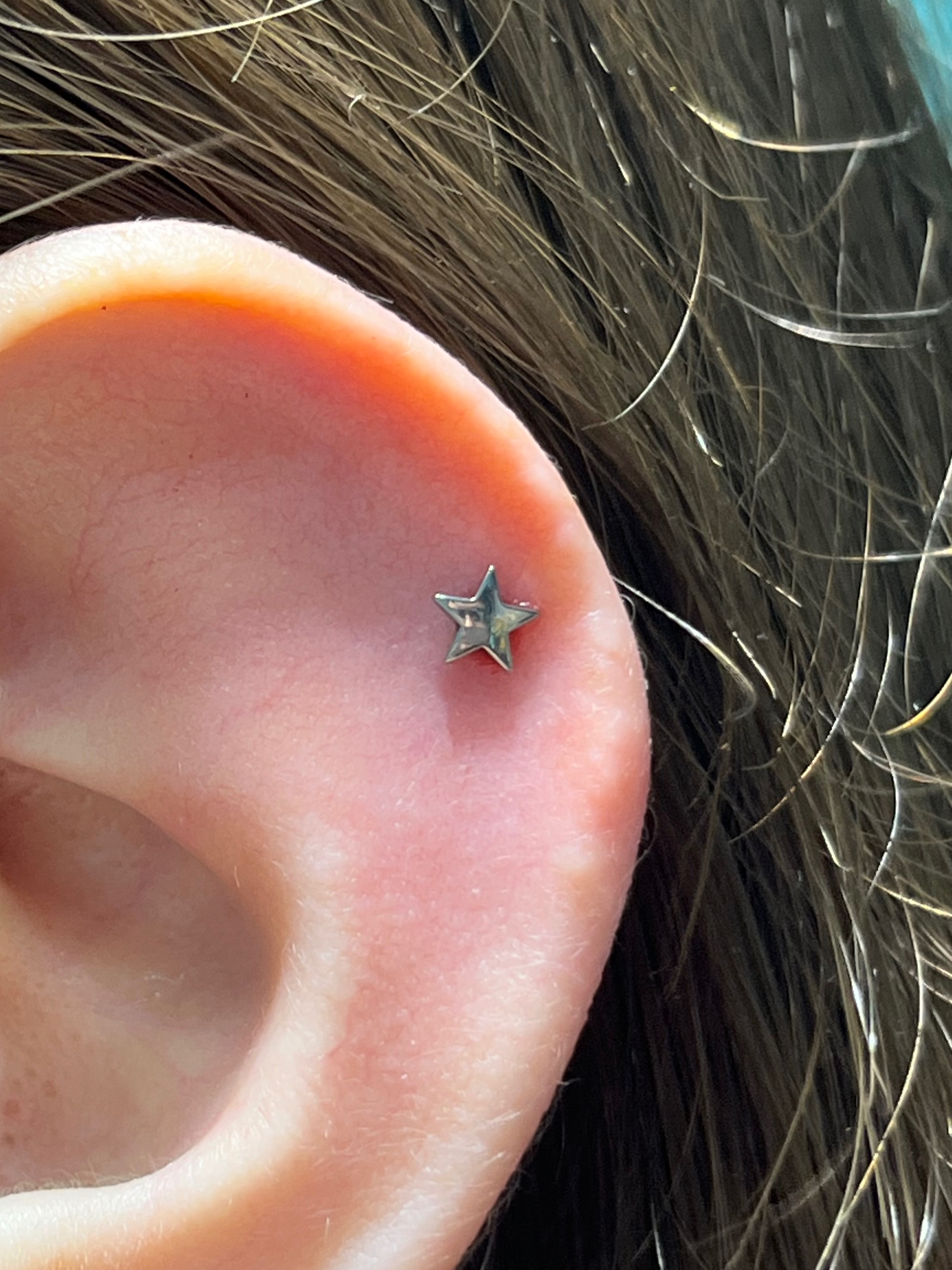 1st Helix piercing with Star by NeoMetal by Harley at Platinum Tattoos & Piercings, San Antonio TX