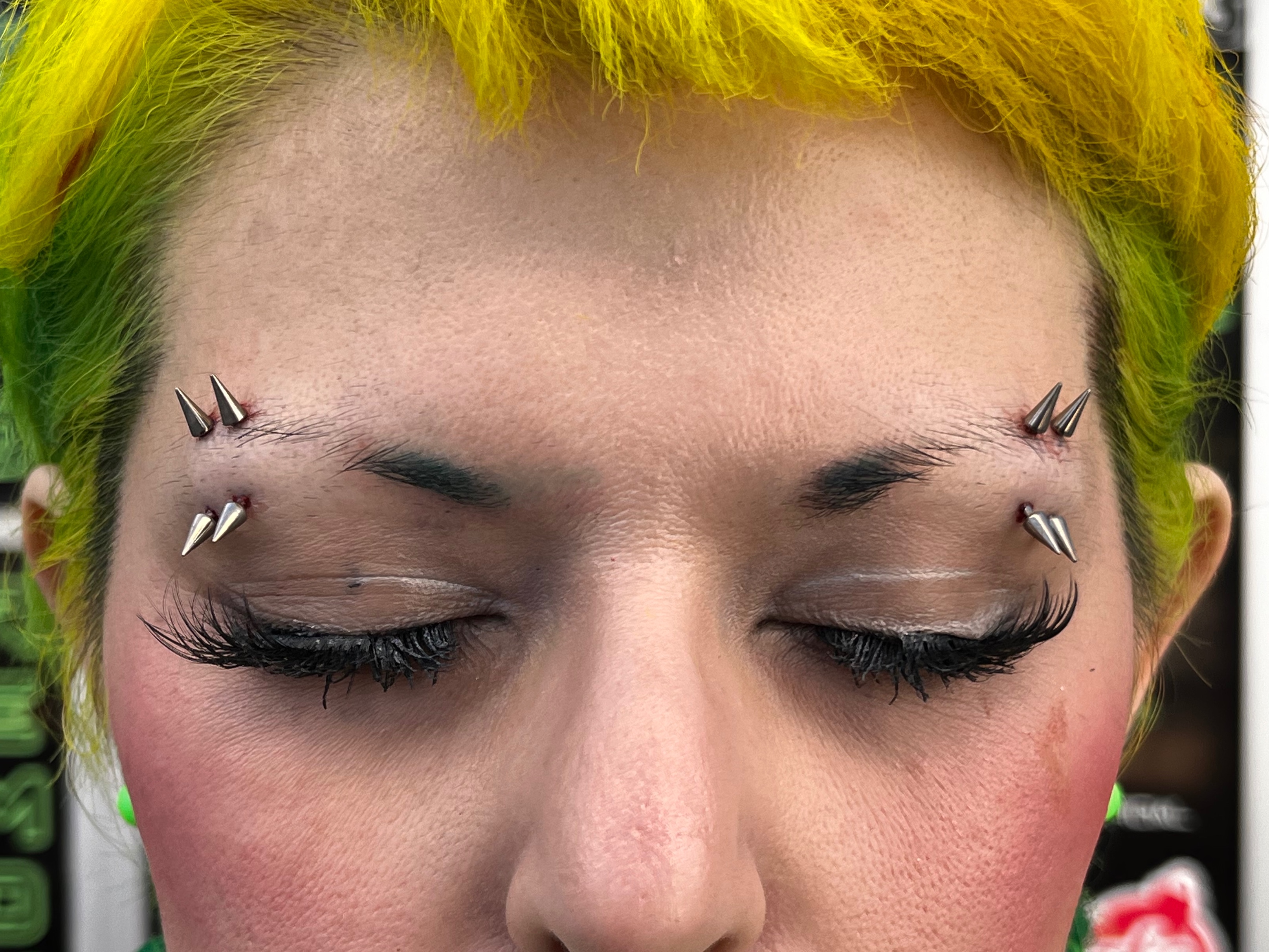 Eyebrow piercing with Implant Grade Titanium Curved Barbell by Other by Harley at Platinum Tattoos & Piercings, San Antonio TX