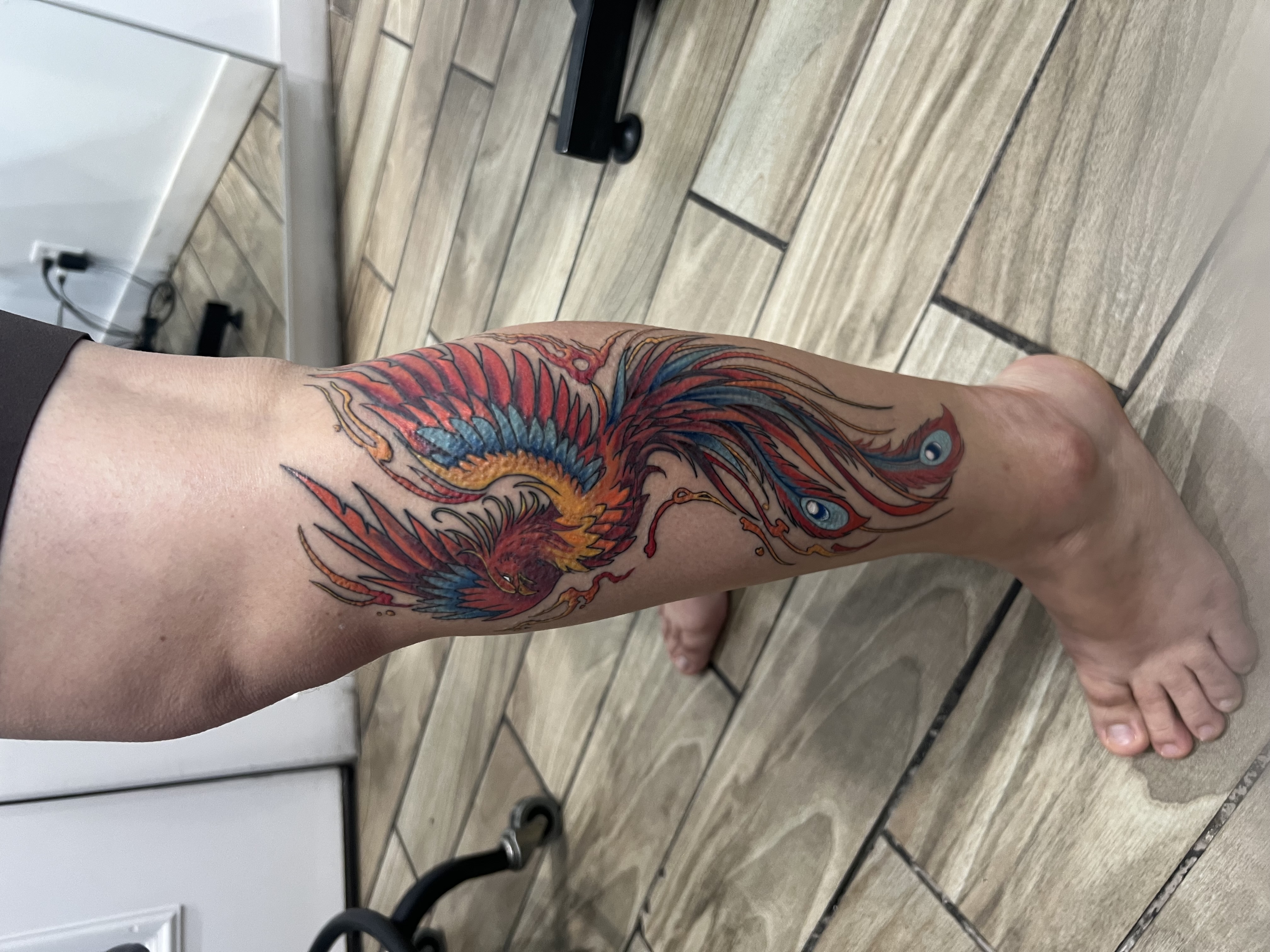 Color, Neo-Traditional, Traditional Phoenix tattoo on the Calf by Jesus at Platinum Tattoos & Piercings, San Antonio TX