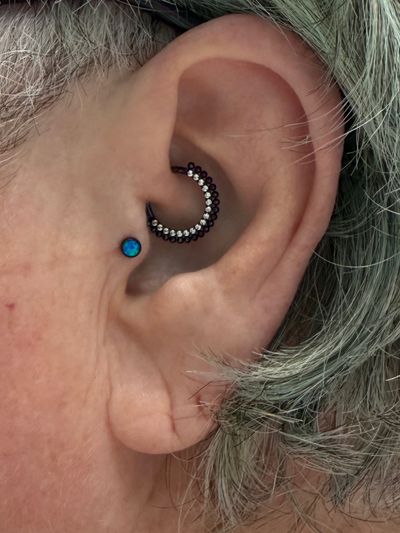Curated ear piercing setup — Tragus, Daith with Implant Grade Titanium Threadless, Clicker by NeoMetal, Other by Mingo at Platinum Tattoos & Piercings, San Antonio TX