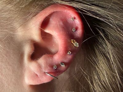 Curated Ear piercing with Implant Grade Titanium Threadless by NeoMetal by Mingo at Platinum Tattoos & Piercings, San Antonio TX