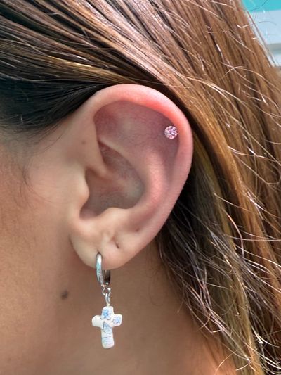 1st Helix piercing with Implant Grade Titanium Threadless by NeoMetal by Mingo at Platinum Tattoos & Piercings, San Antonio TX