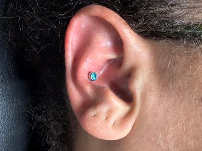 Conch piercing with Implant Grade Titanium Threadless by NeoMetal by Mingo at Platinum Tattoos & Piercings, San Antonio TX