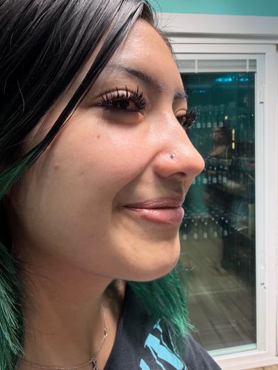 Nostril piercing with Implant Grade Titanium Disc by NeoMetal by Mingo at Platinum Tattoos & Piercings, San Antonio TX