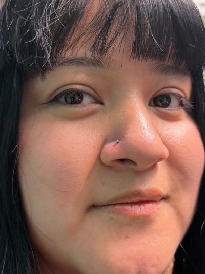 Nostril piercing with Implant Grade Titanium Threadless by NeoMetal by Mingo at Platinum Tattoos & Piercings, San Antonio TX
