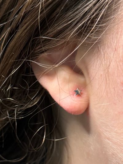 1st Lobe piercing with Implant Grade Titanium Threadless by NeoMetal by Mingo at Platinum Tattoos & Piercings, San Antonio TX