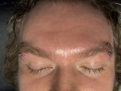 Eyebrow piercing with Implant Grade Titanium Curved Barbell by Other by Mingo at Platinum Tattoos & Piercings, San Antonio TX