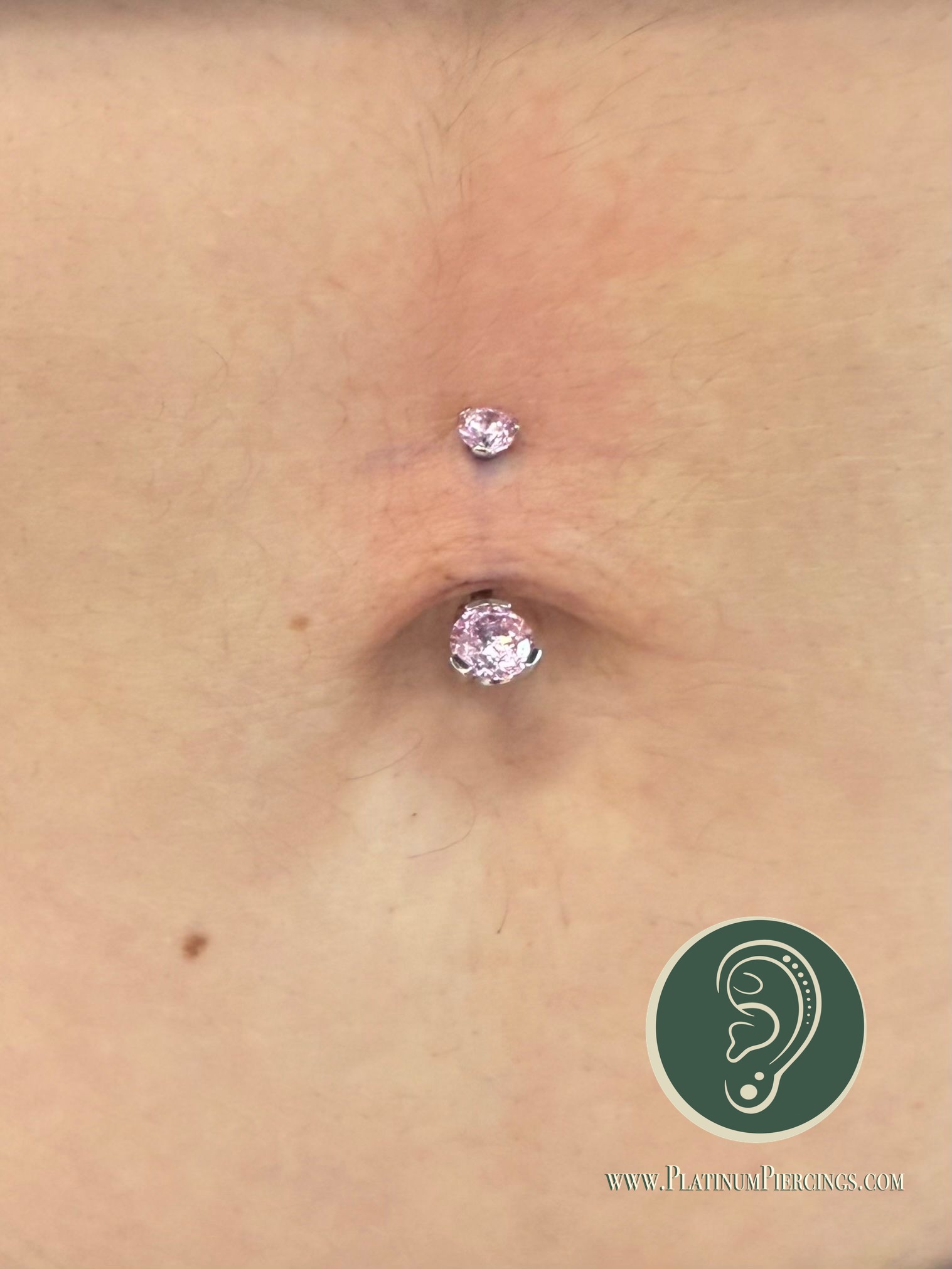 Belly Button piercing with Implant Grade Titanium Curved Barbell by Industrial Strength by Crystal at Platinum Body Piercings, San Antonio TX