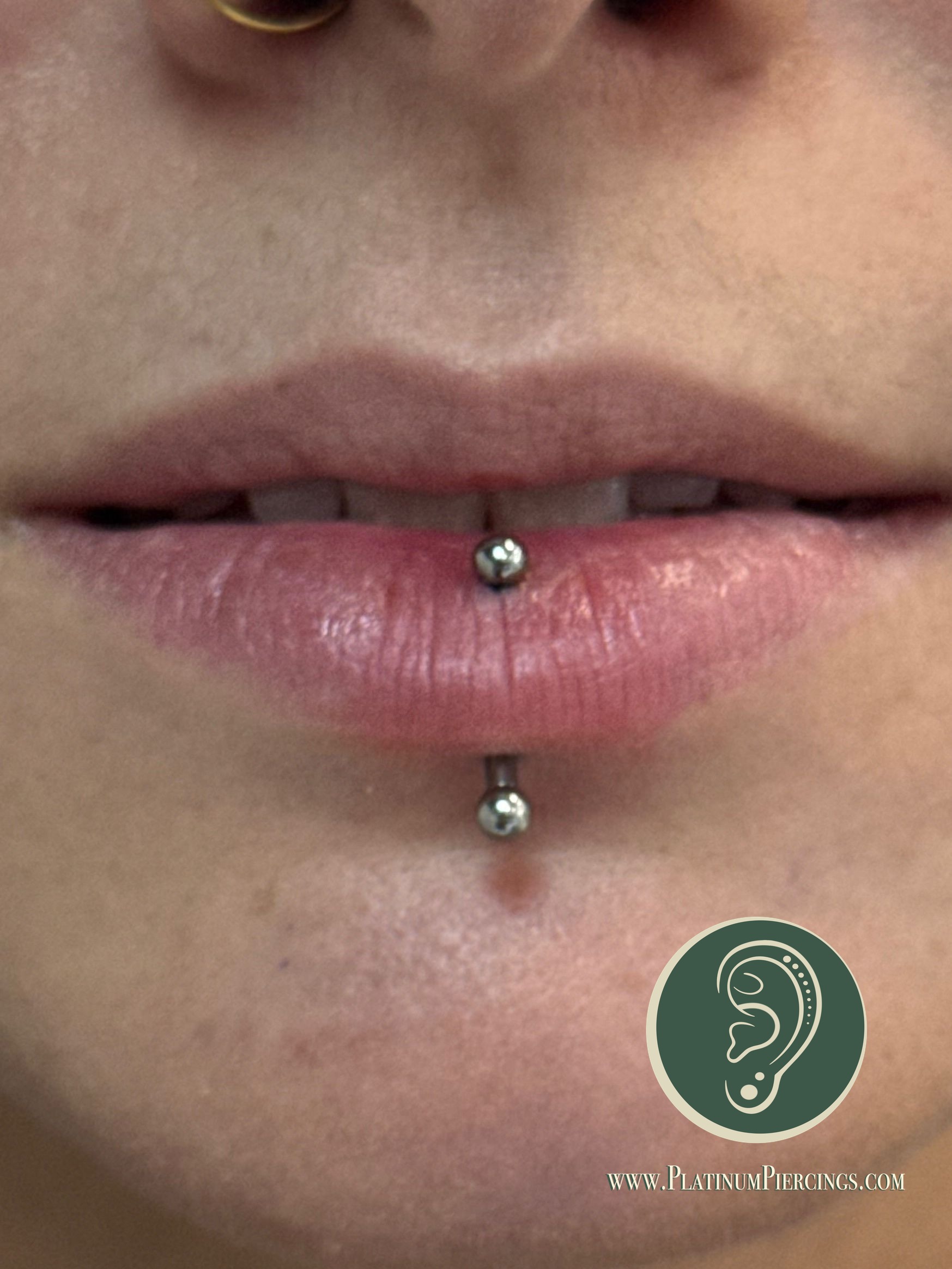 Vertical Labret piercing with Implant Grade Titanium Curved Barbell by NeoMetal by Crystal at Platinum Body Piercings, San Antonio TX
