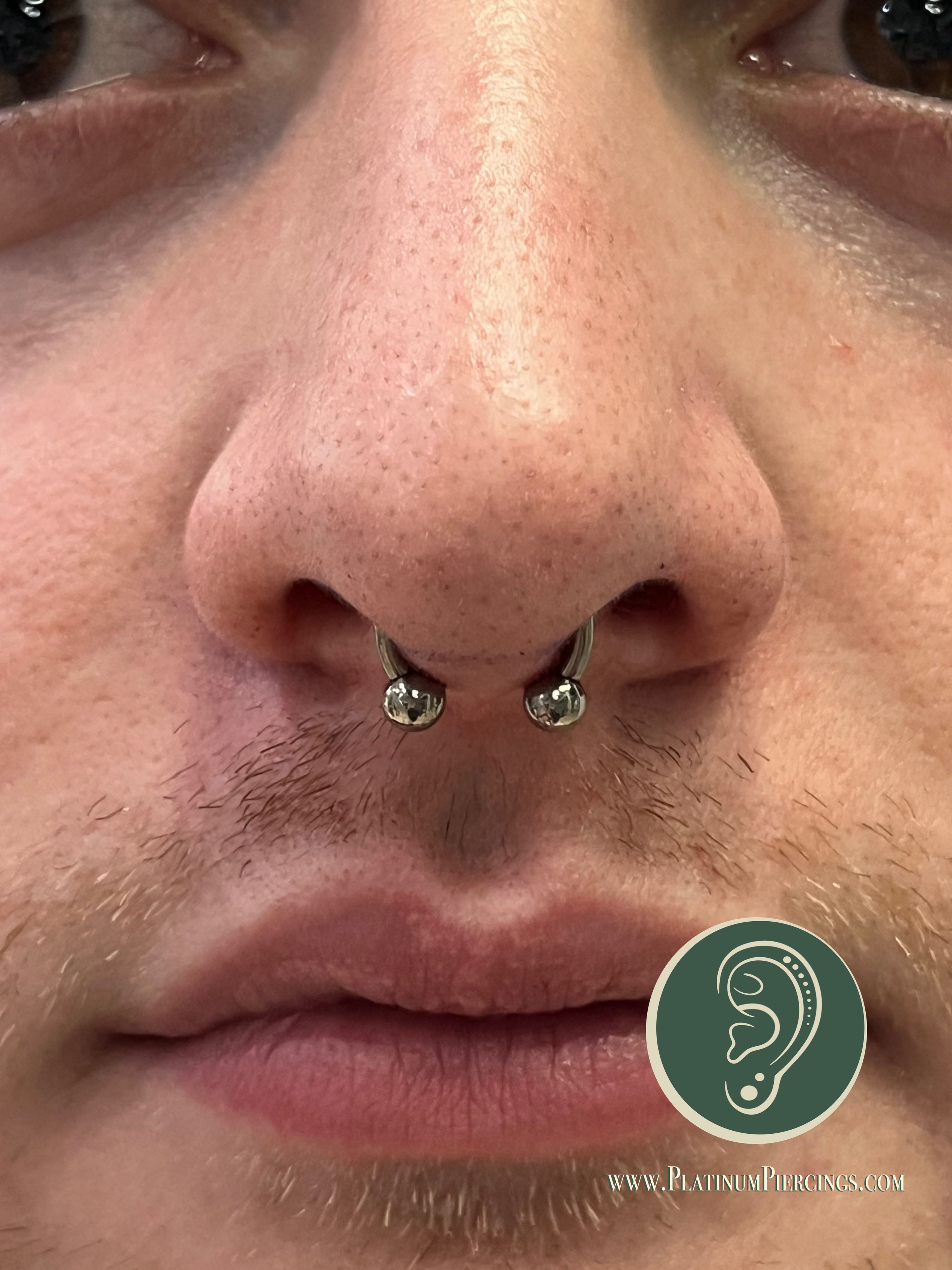Septum piercing with Implant Grade Titanium Circular Barbell by Other by Harley at Platinum Body Piercings, San Antonio TX