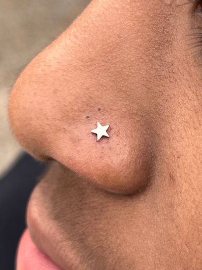 Nostril piercing with Implant Grade Titanium Star by NeoMetal by Harley at Platinum Tattoos & Piercings, San Antonio TX