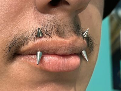 Vertical Labret piercing with Implant Grade Titanium Spike by Other by Harley at Platinum Tattoos & Piercings, San Antonio TX