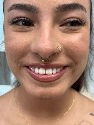 Septum piercing with Implant Grade Titanium Circular Barbell by JC at Platinum Tattoos & Piercings, San Antonio TX
