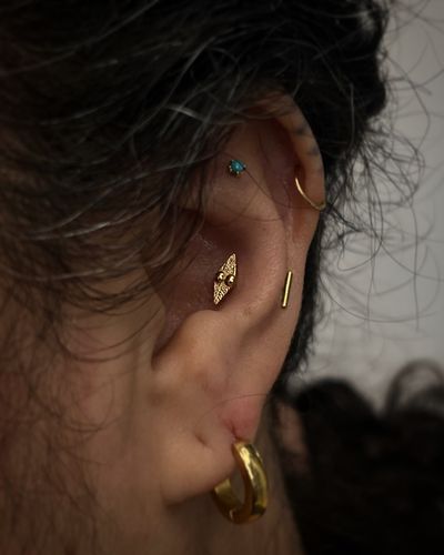 Conch piercing with 14k Yellow Gold Threadless by JC at Platinum Tattoos & Piercings, San Antonio TX