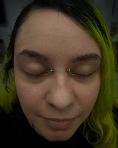 Bridge piercing with Implant Grade Titanium Barbell by Anatometal by JC at Platinum Tattoos & Piercings, San Antonio TX