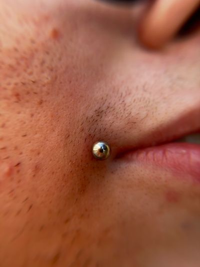 piercing Labret on the Cheek by Jaycee