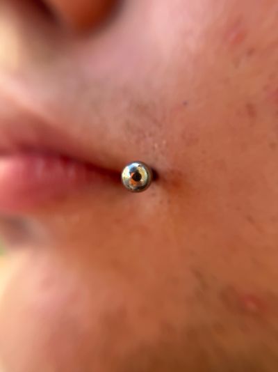 piercing Labret on the Cheek by Jaycee