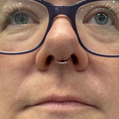 Septum piercing with 14k Yellow Gold Clicker by Tawapa by Crystal at Platinum Body Piercings, San Antonio TX