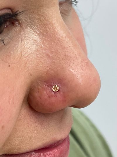 Nostril piercing with 14k Yellow Gold Threadless by Junipurr by Crystal at Platinum Body Piercings, San Antonio TX