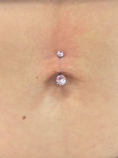 Belly Button piercing with Implant Grade Titanium Curved Barbell by Industrial Strength by Crystal at Platinum Body Piercings, San Antonio TX