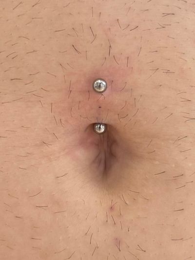 Belly Button piercing with Implant Grade Titanium Curved Barbell by Industrial Strength by Crystal at Platinum Body Piercings, San Antonio TX