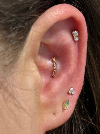 Conch piercing with 14k Yellow Gold Labret Stud/Flat Back by Tawapa by Crystal at Platinum Body Piercings, San Antonio TX