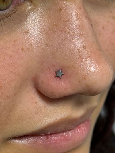 Nostril piercing with Implant Grade Titanium Labret Stud/Flat Back by NeoMetal by Crystal at Platinum Body Piercings, San Antonio TX