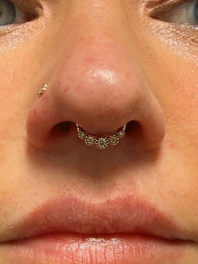 Septum piercing with 14k Yellow Gold Hoop/Ring by Tawapa by Crystal at Platinum Body Piercings, San Antonio TX