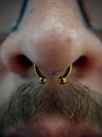 Septum piercing with Implant Grade Titanium Circular Barbell by Jaycee at Platinum Body Piercings, San Antonio TX