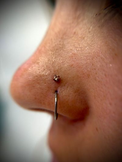 Nostril piercing with Implant Grade Titanium Threadless by NeoMetal by Jaycee at Platinum Body Piercings, San Antonio TX