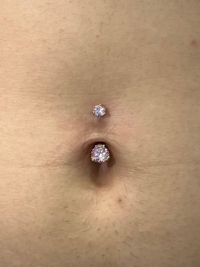Belly Button piercing with Implant Grade Titanium Curved Barbell by Industrial Strength by Harley at Platinum Body Piercings, San Antonio TX