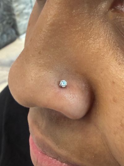 Nostril piercing with Implant Grade Titanium Labret Stud/Flat Back by NeoMetal by Crystal at Platinum Body Piercings, San Antonio TX
