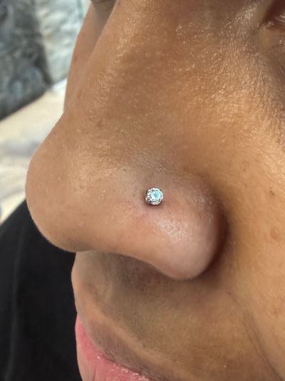 Nostril piercing with Implant Grade Titanium Labret Stud/Flat Back by NeoMetal by Crystal at Platinum Body Piercings, San Antonio TX