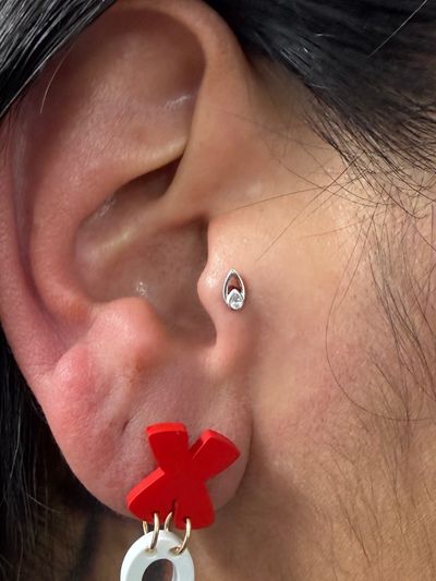 Tragus piercing with 14k White Gold Labret Stud/Flat Back by Tawapa by Crystal at Platinum Body Piercings, San Antonio TX