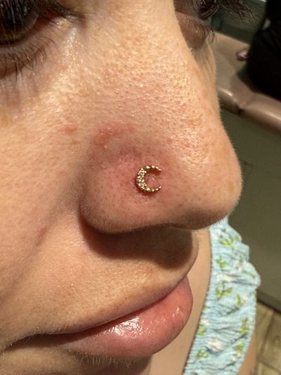 Nostril piercing with 14k Yellow Gold Labret Stud/Flat Back by Tawapa by Crystal at Platinum Body Piercings, San Antonio TX