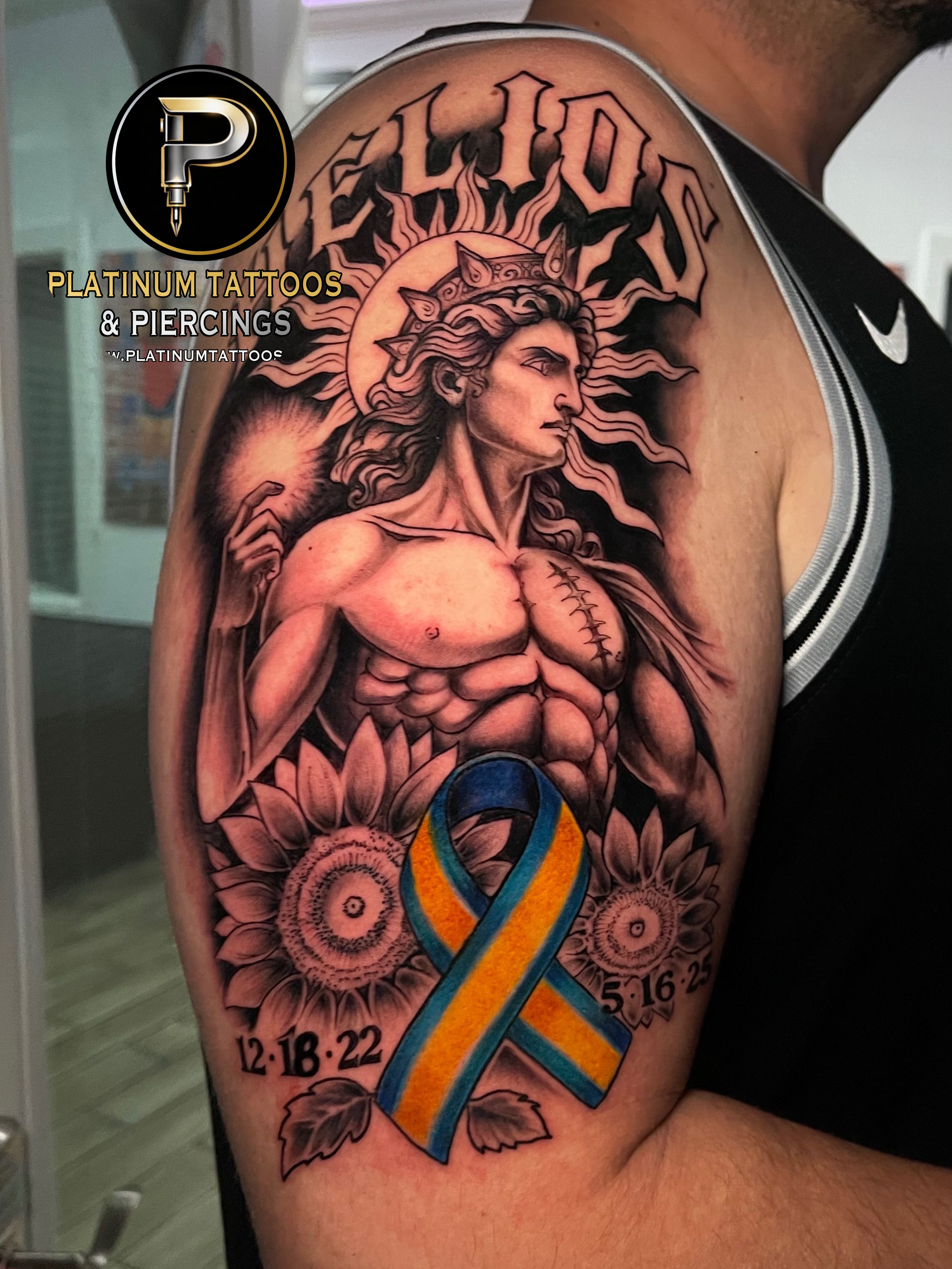Black & Grey Black, Yellow, Blue tattoo on the Upper Arm by Skar at Platinum Tattoos & Piercings, San Antonio TX