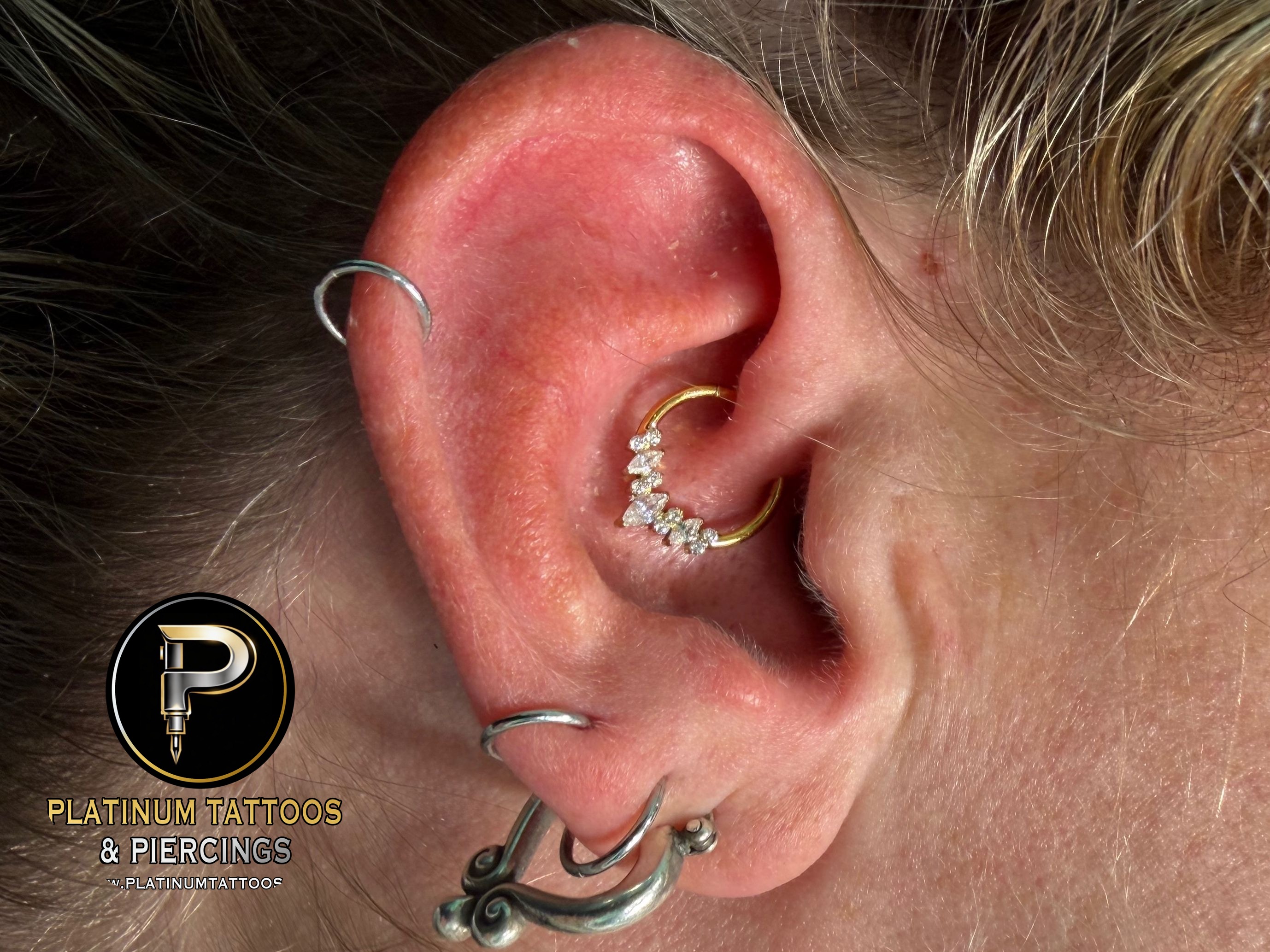 Daith piercing with Implant Grade Titanium Clicker by Other by Mingo at Platinum Tattoos & Piercings, San Antonio TX