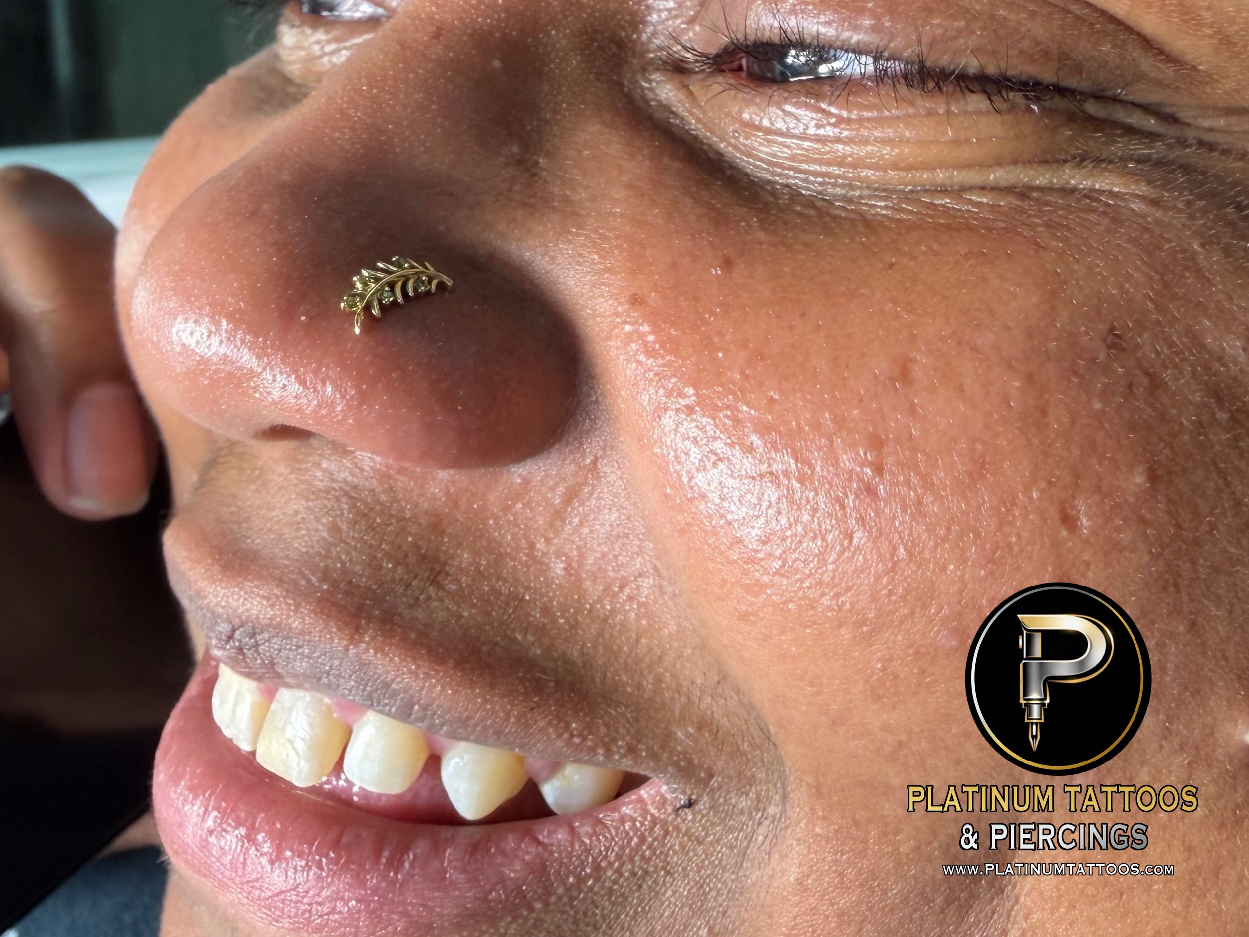 Nostril piercing with 14k Yellow Gold Threadless by Mingo at Platinum Tattoos & Piercings, San Antonio TX