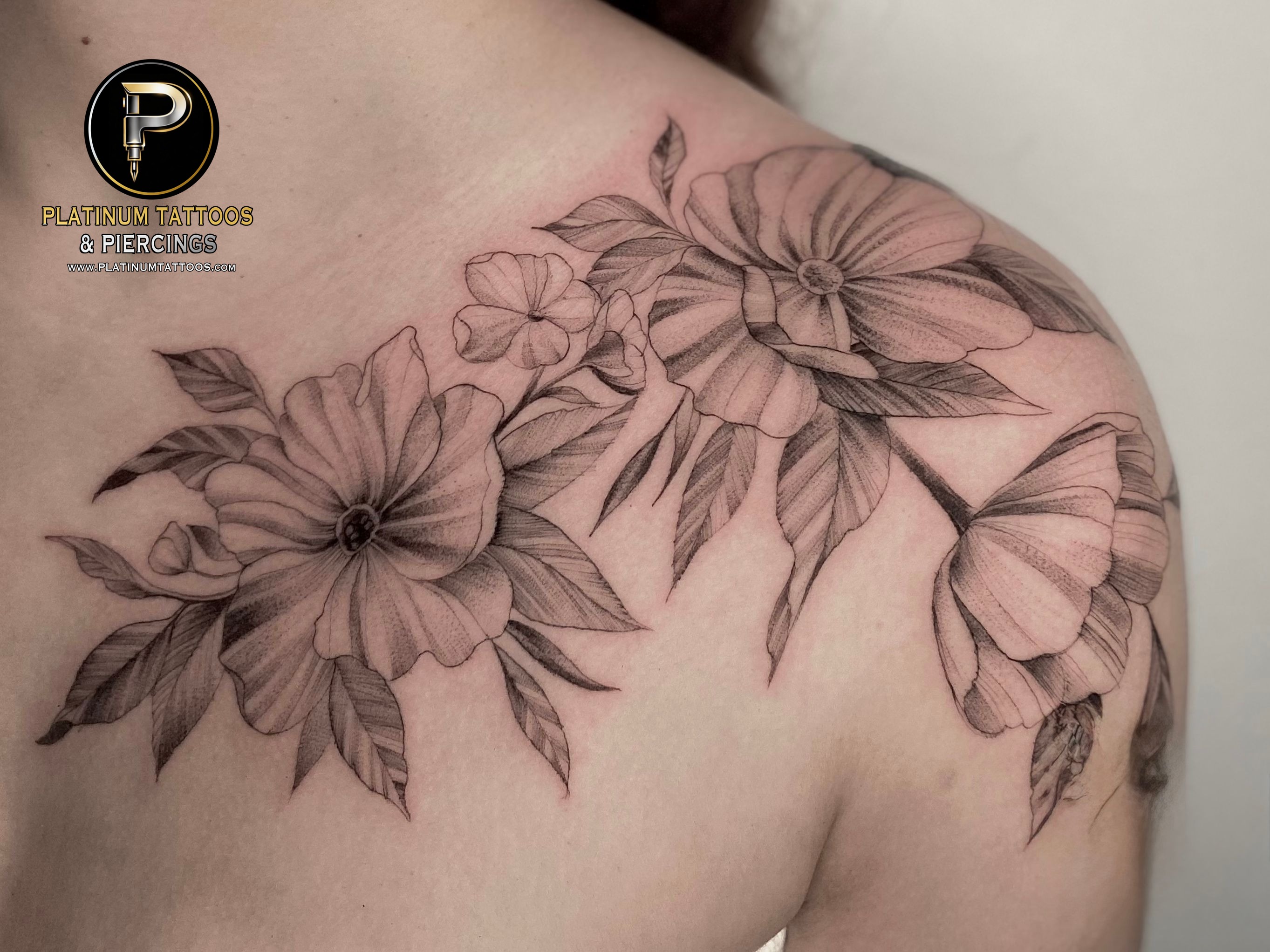 Floral tattoo on the chest by Remy at Platinum Tattoos & Piercings, San Antonio TX